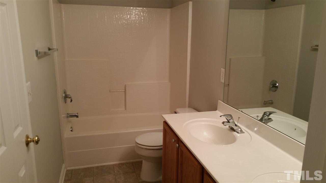 4301 Standing Rock Way Raleigh, NC 27604 - Photo 16 of 22 a bathroom with a sink toilet and shower