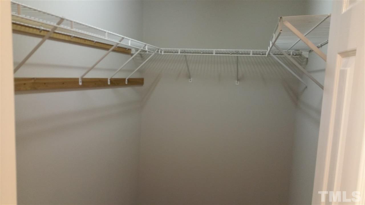 4301 Standing Rock Way Raleigh, NC 27604 - Photo 17 of 22 a view of walk in closet with empty racks