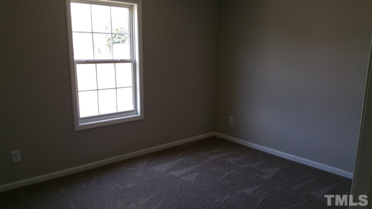 4301 Standing Rock Way Raleigh, NC 27604 - Photo 19 of 22 an empty room with a window