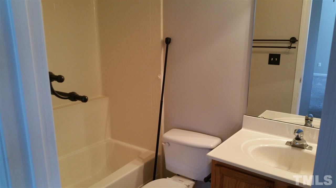 4301 Standing Rock Way Raleigh, NC 27604 - Photo 20 of 22 a bathroom with a sink toilet and shower