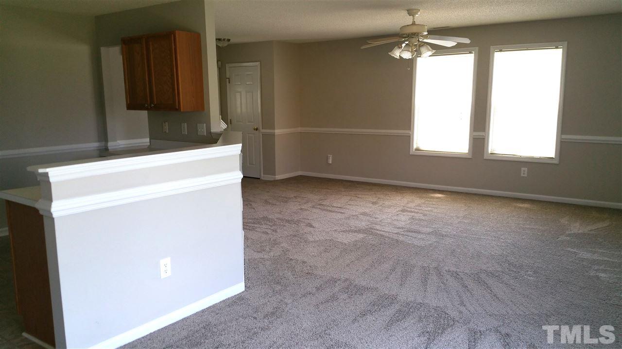 4301 Standing Rock Way Raleigh, NC 27604 - Photo 5 of 22 a view of empty room with window and refrigerator