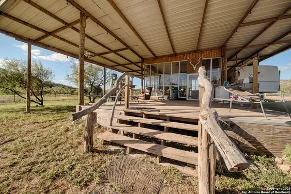 a view of balcony with couch and wooden floor