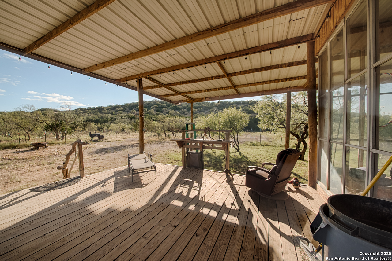2205 SD 45700 Rocksprings, TX 78880 - Photo 20 of 30 a view of balcony with couch and wooden floor