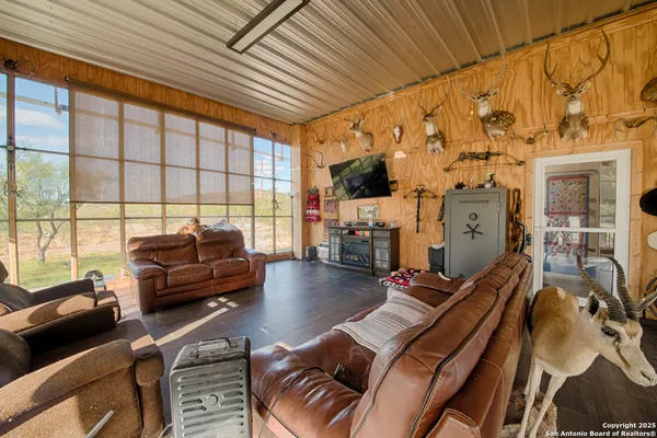 a kitchen with a sink a stove and cabinets