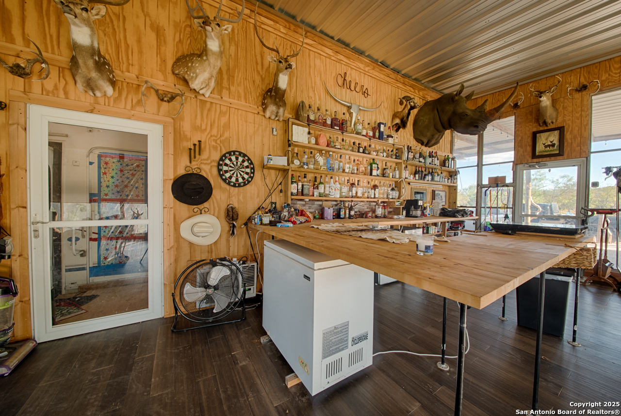 2205 SD 45700 Rocksprings, TX 78880 - Photo 24 of 30 a kitchen with a sink a stove and cabinets