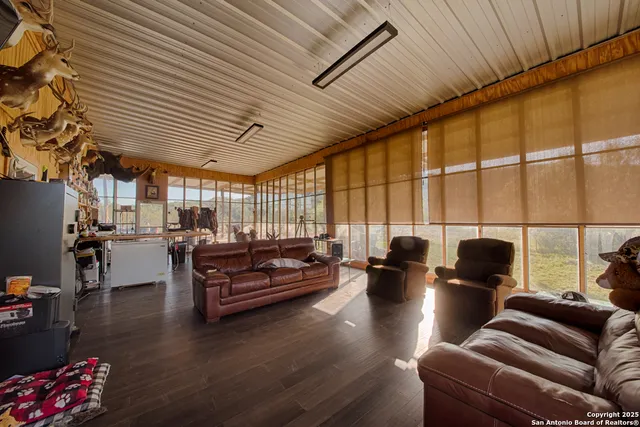 a very nice looking living room with dining room and wooden floor