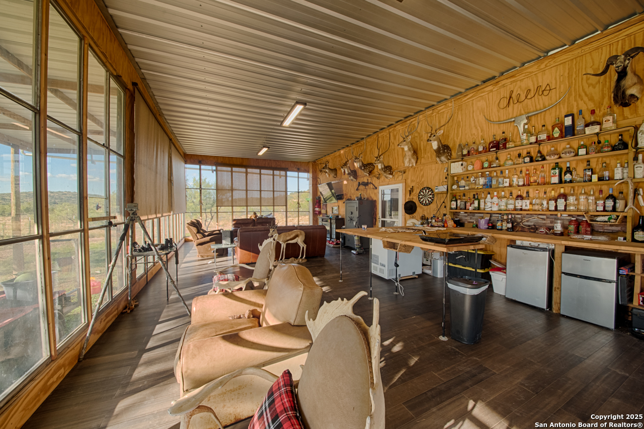 2205 SD 45700 Rocksprings, TX 78880 - Photo 26 of 30 a very nice looking living room with dining room and wooden floor