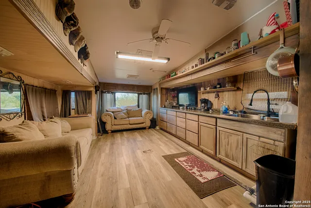 a bedroom with a bed next to a window