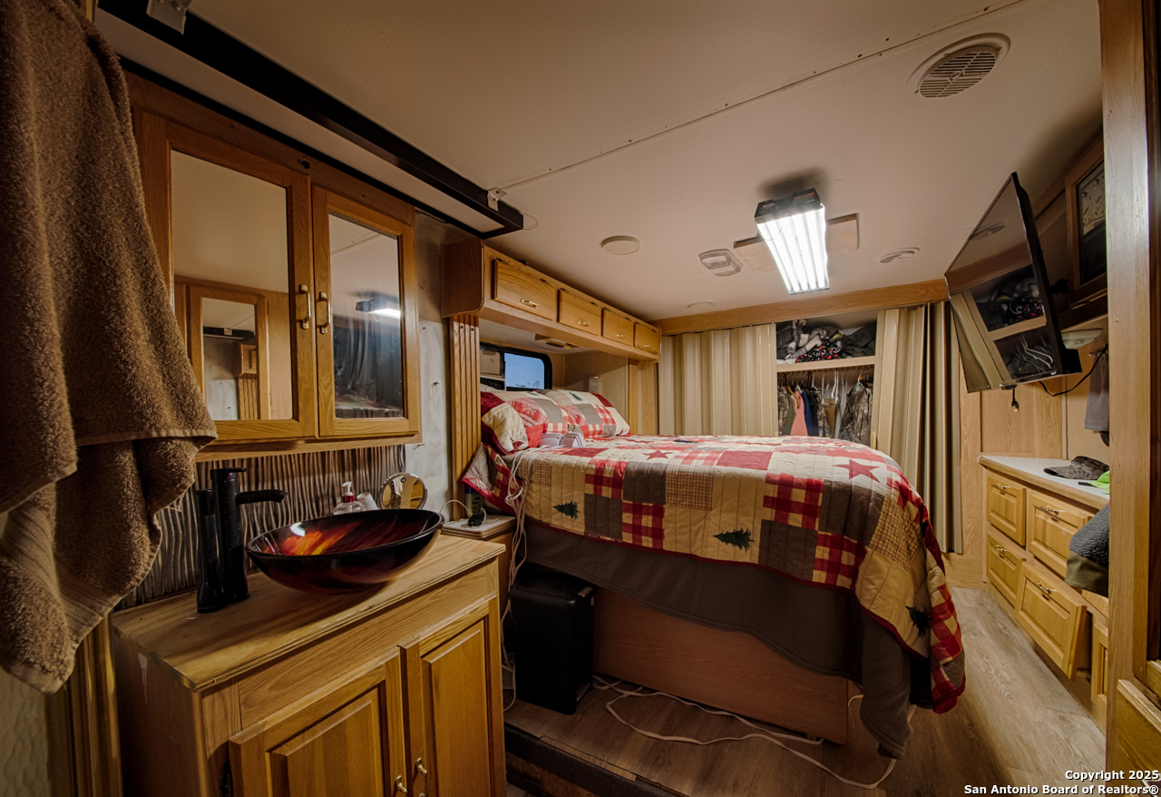 2205 SD 45700 Rocksprings, TX 78880 - Photo 28 of 30 a bedroom with a bed next to a window