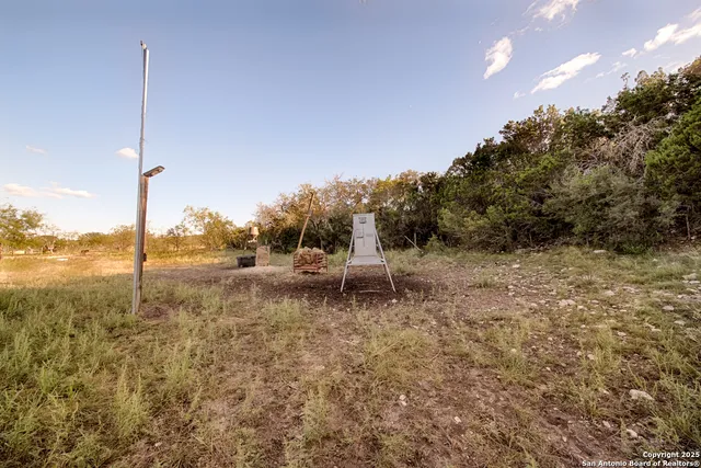 a view of a floor to ceiling window next to a yard