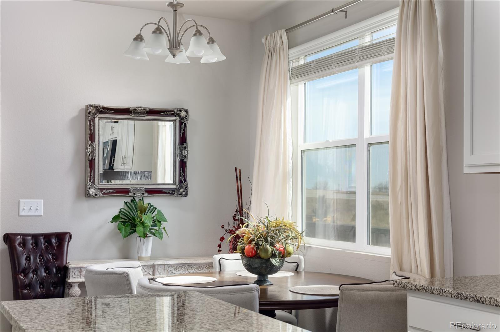 Undisclosed Address Berthoud, CO 80513 - Photo 11 of 26 a view of a dining room with furniture window and wooden floor