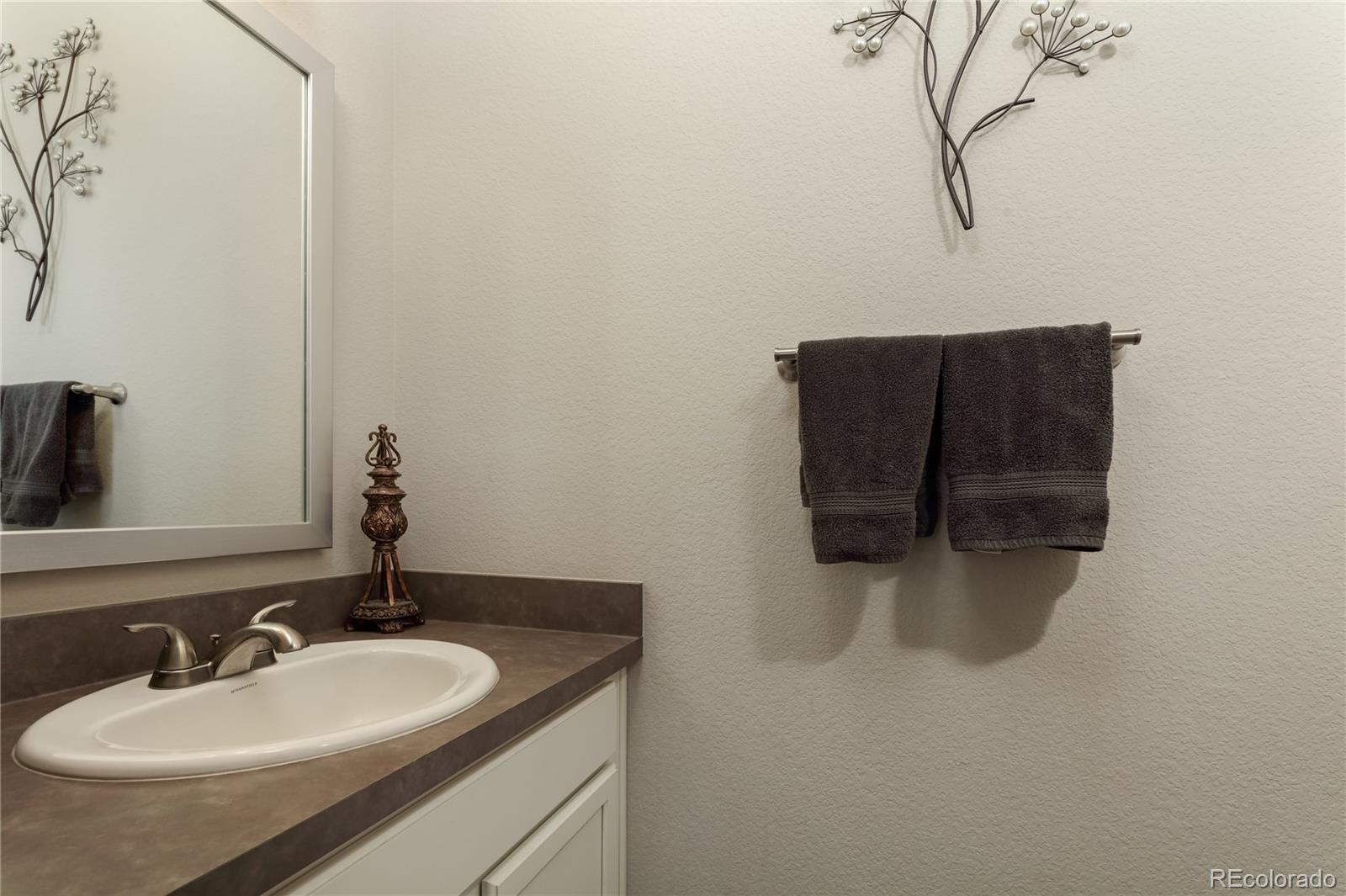 Undisclosed Address Berthoud, CO 80513 - Photo 13 of 26 a bathroom with a sink and a mirror