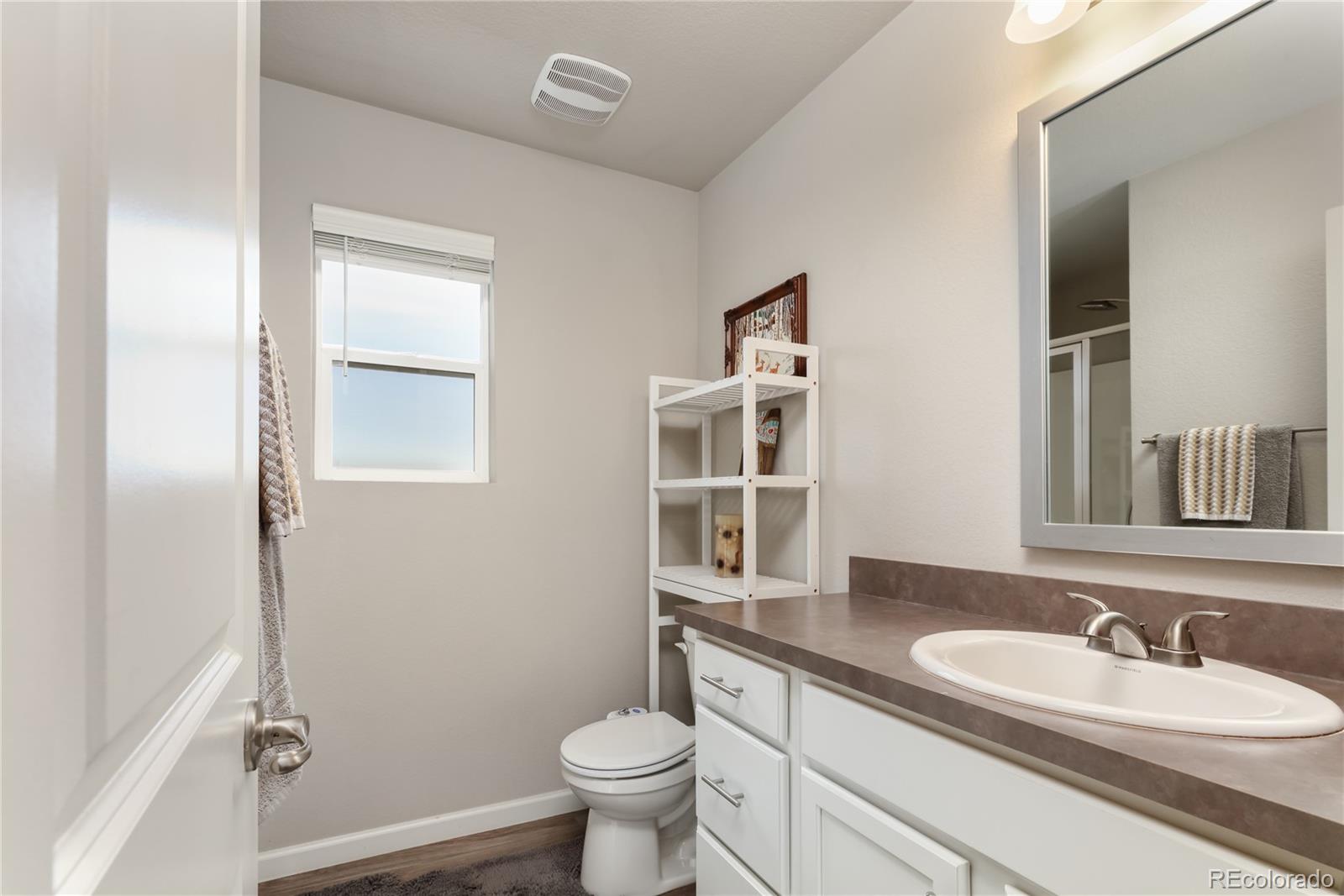 Undisclosed Address Berthoud, CO 80513 - Photo 17 of 26 a bathroom with a granite countertop sink toilet and shower