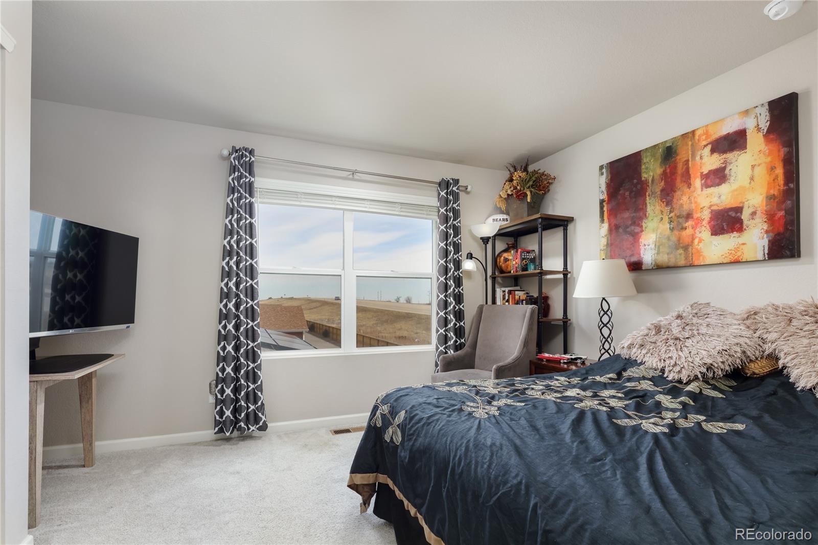 Undisclosed Address Berthoud, CO 80513 - Photo 18 of 26 a bedroom with a bed and a window