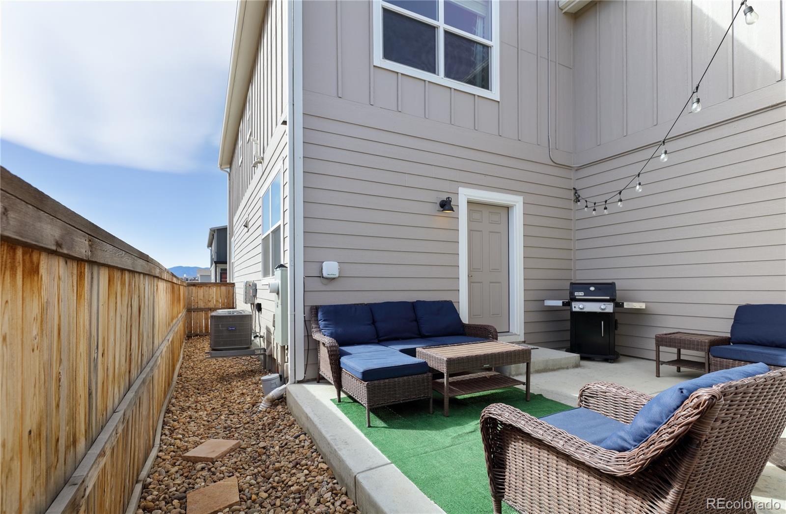 Undisclosed Address Berthoud, CO 80513 - Photo 21 of 26 a backyard of a house with barbeque oven table and chairs