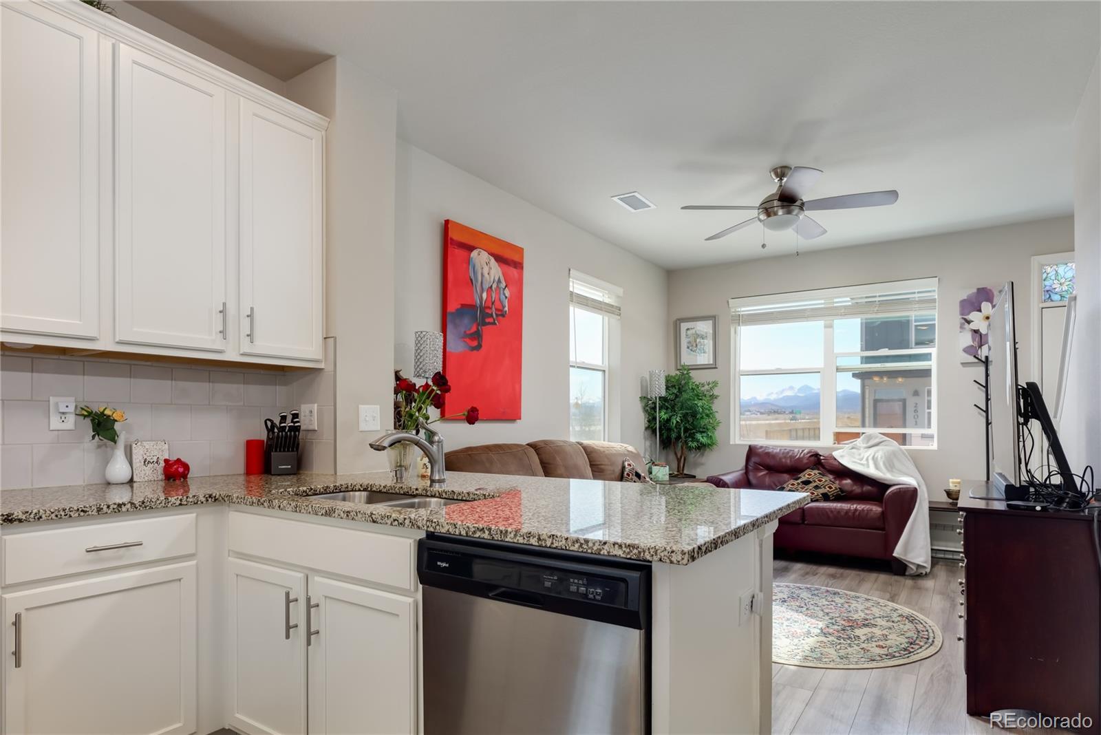 Undisclosed Address Berthoud, CO 80513 - Photo 5 of 26 a kitchen with granite countertop a sink stove top oven and cabinets