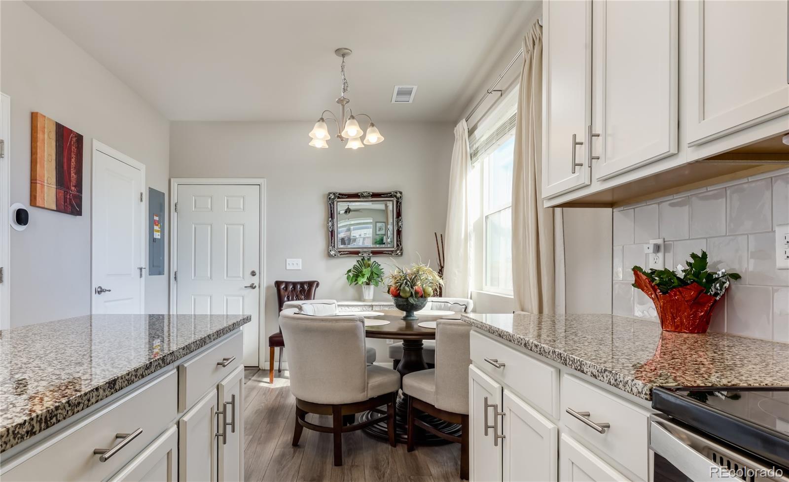 Undisclosed Address Berthoud, CO 80513 - Photo 9 of 26 a kitchen with stainless steel appliances kitchen island granite countertop a sink and cabinets