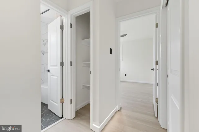 a view of a bathroom with a glass shower door