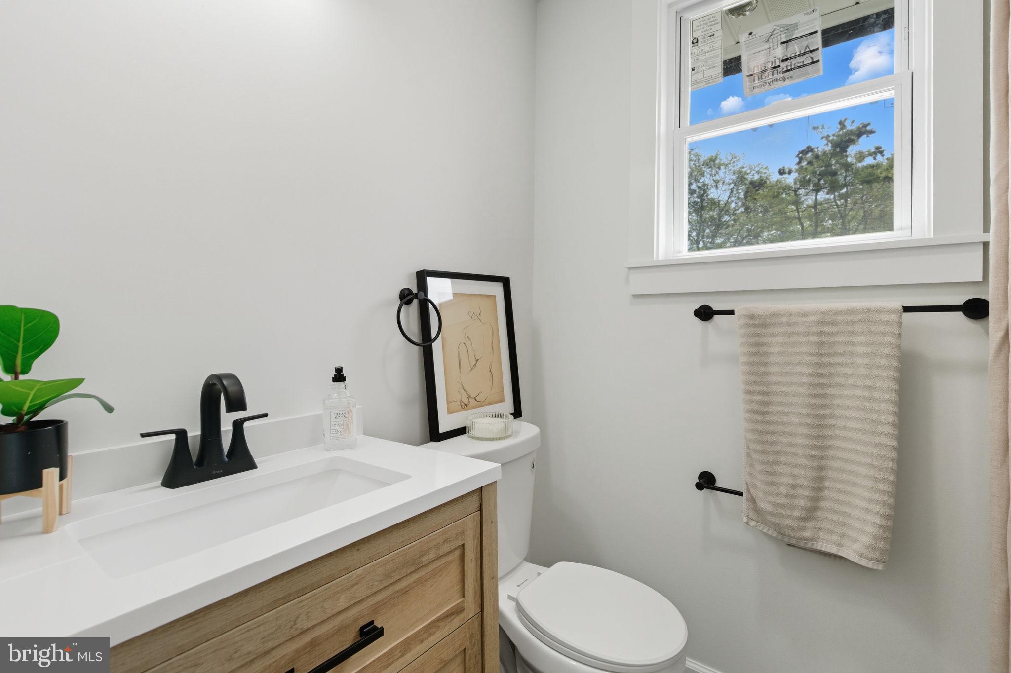 151 Dolington Road Yardley, PA 19067 - Photo 25 of 39 a bathroom with a sink a toilet and mirror