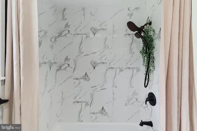 a view of empty room with ceiling fan