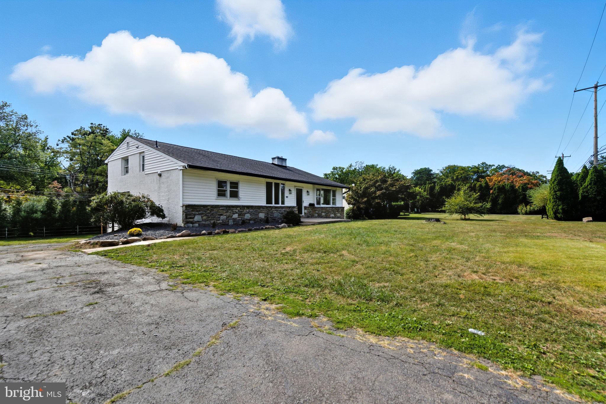 151 Dolington Road Yardley, PA 19067 - Photo 3 of 39 a front view of a house with yard and green space