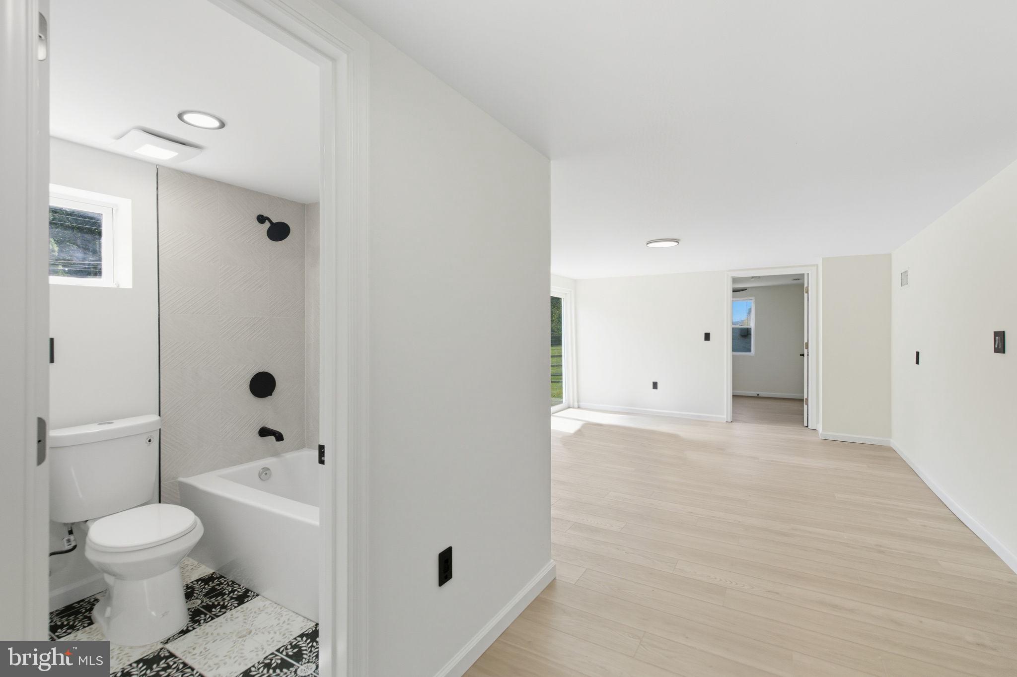 151 Dolington Road Yardley, PA 19067 - Photo 31 of 39 a bathroom with a toilet sink a shower and a bathtub