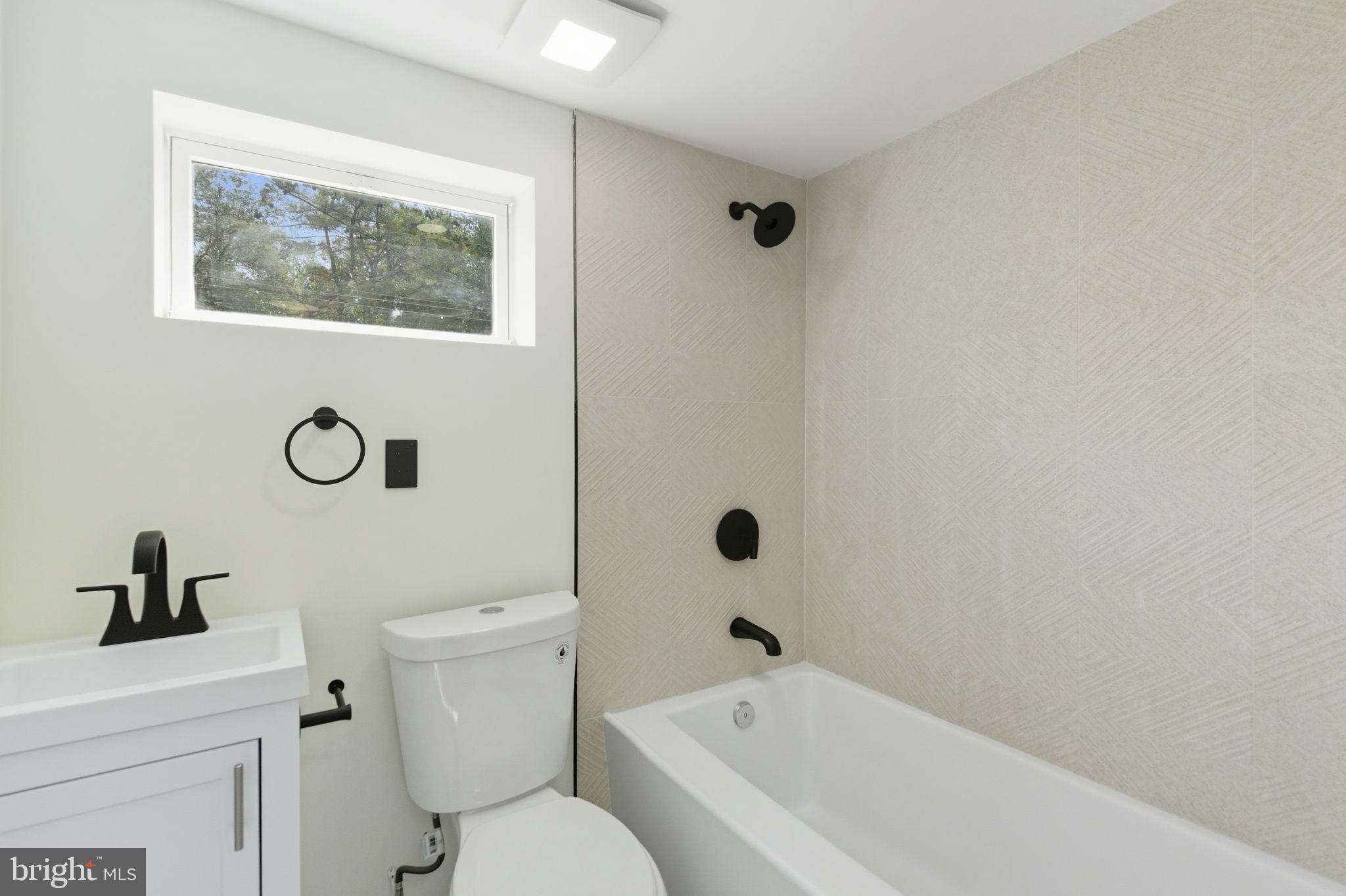 151 Dolington Road Yardley, PA 19067 - Photo 32 of 39 a bathroom with a toilet and a sink