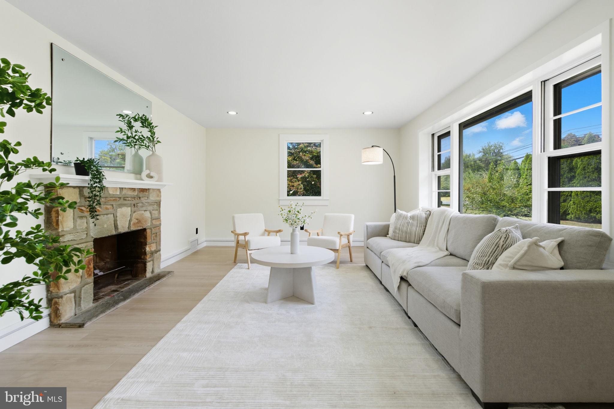 151 Dolington Road Yardley, PA 19067 - Photo 5 of 39 a living room with furniture and a fireplace
