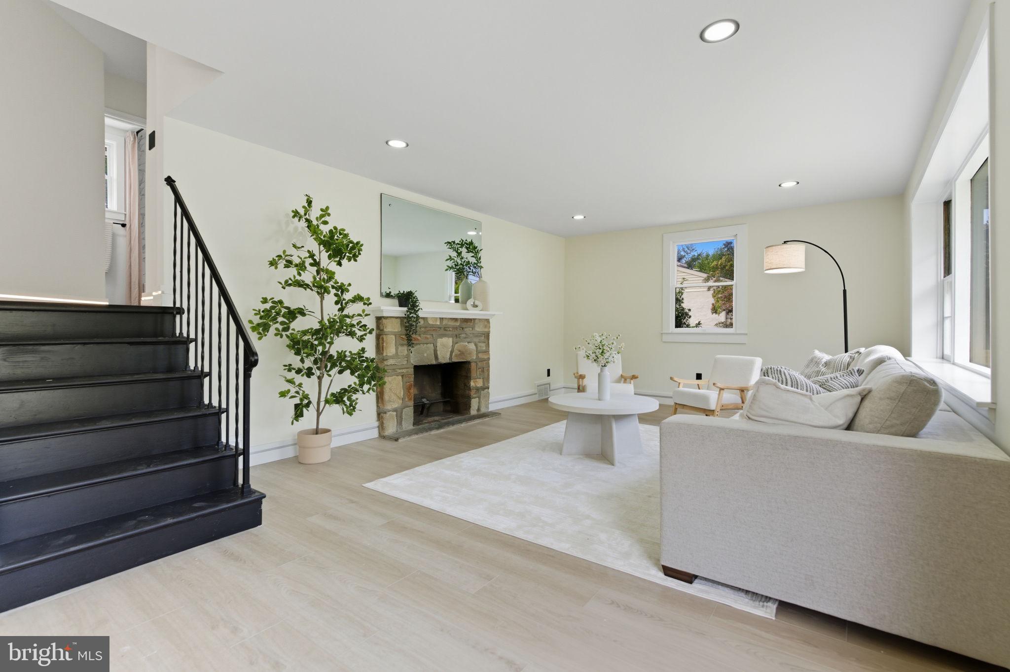 151 Dolington Road Yardley, PA 19067 - Photo 7 of 39 a living room with furniture and a fireplace
