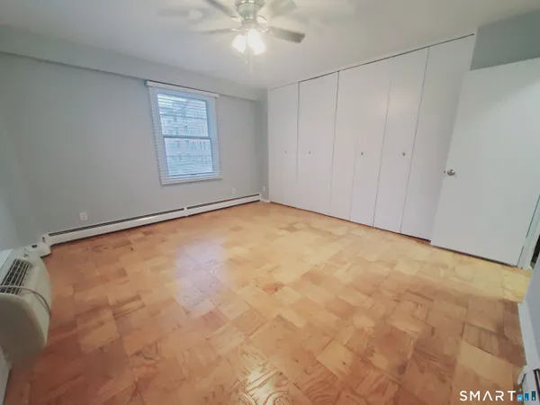 a view of an empty room with a window