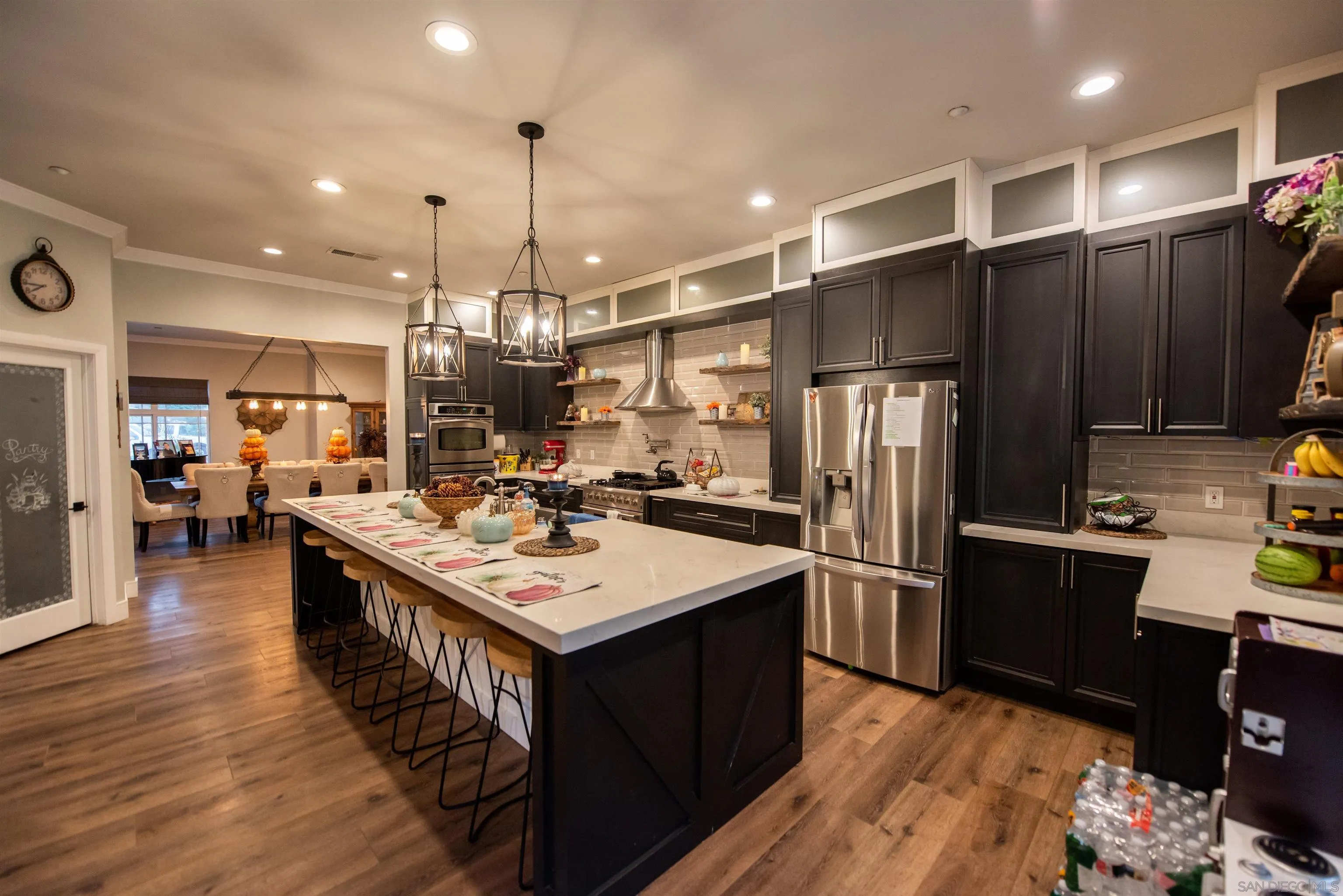 8945 Diamondback Drive Santee, CA 92071 - Photo 16 of 49 a kitchen with kitchen island a sink stove and refrigerator