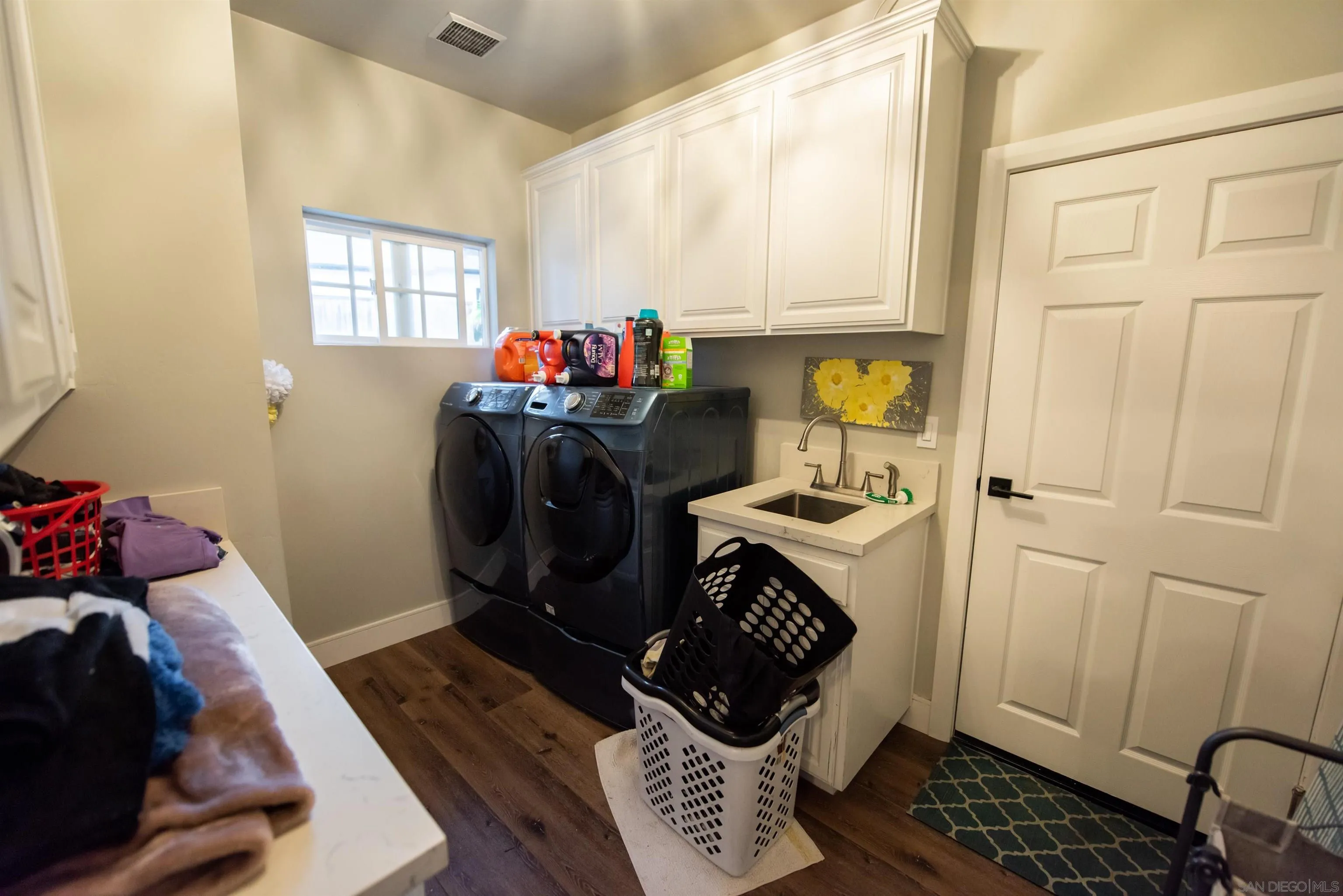 8945 Diamondback Drive Santee, CA 92071 - Photo 23 of 49 a bathroom with a sink toilet and window