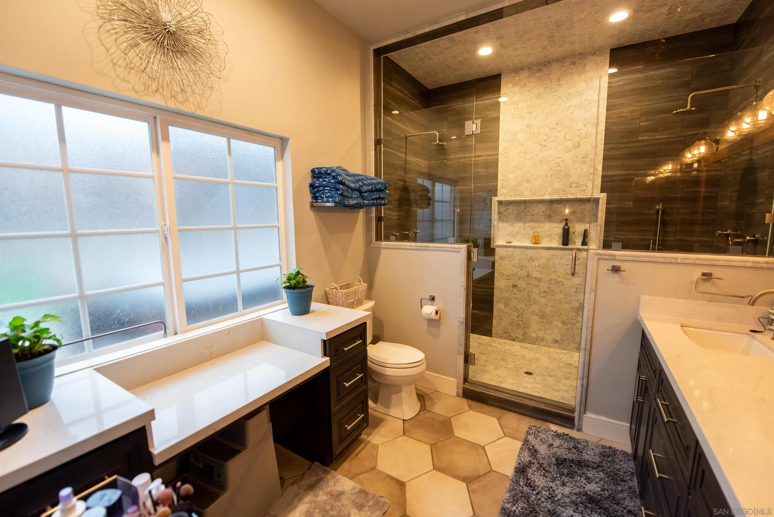 8945 Diamondback Drive Santee, CA 92071 - Photo 24 of 49 a bathroom with a sink a toilet and shower