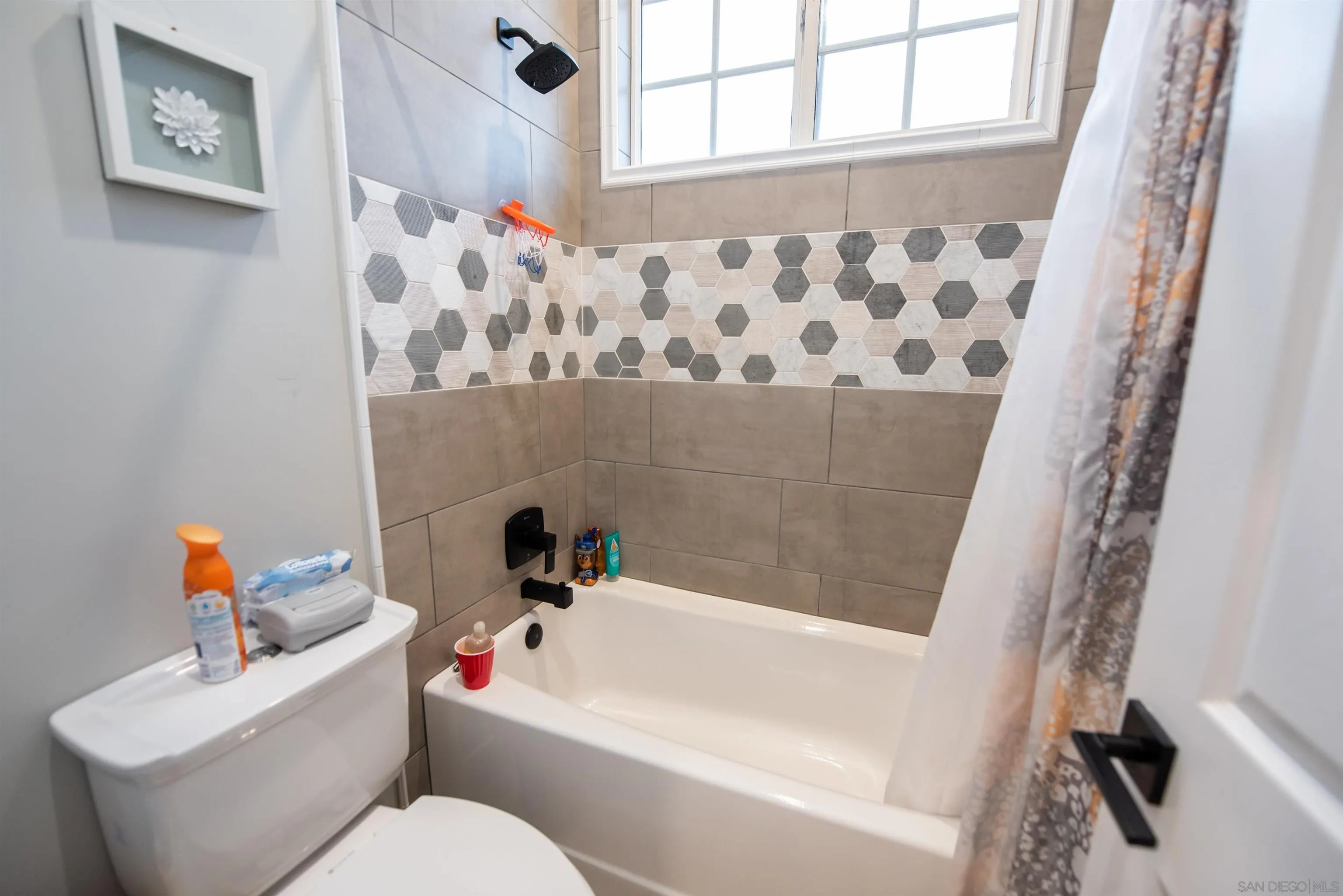 8945 Diamondback Drive Santee, CA 92071 - Photo 27 of 49 a bathroom with a sink and a bathtub