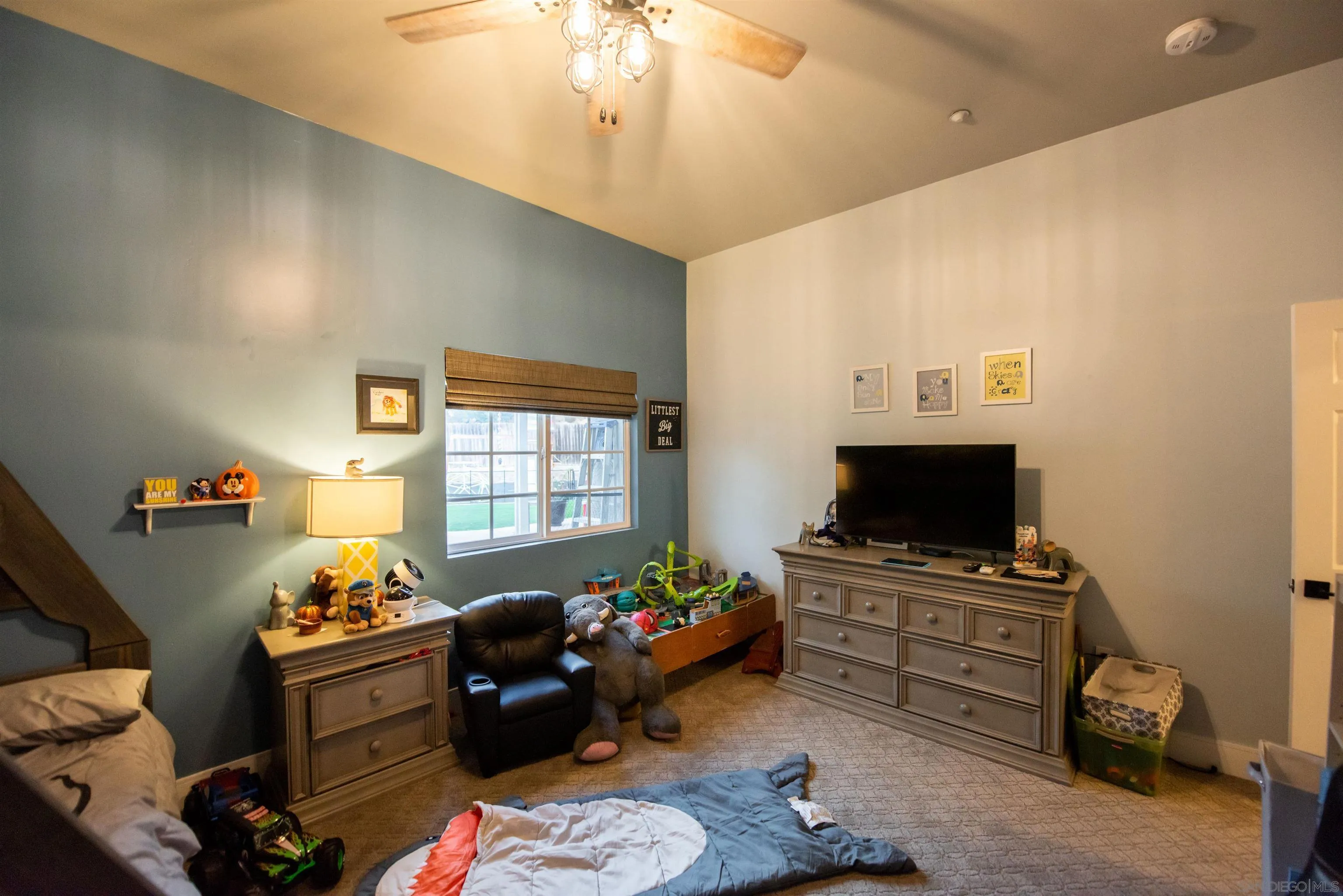 8945 Diamondback Drive Santee, CA 92071 - Photo 29 of 49 a living room with furniture and a flat screen tv
