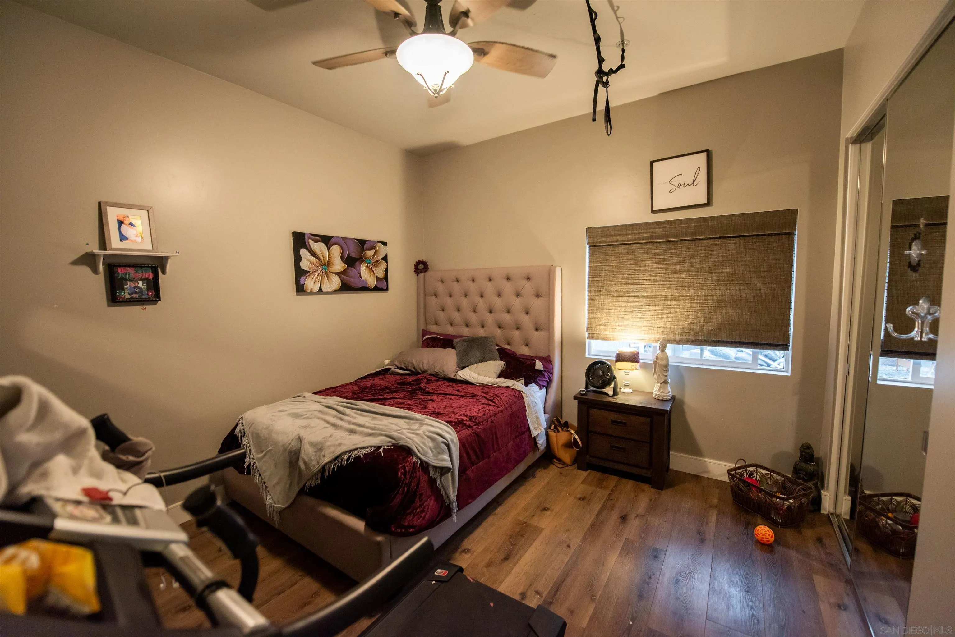 8945 Diamondback Drive Santee, CA 92071 - Photo 30 of 49 a bedroom with a bed and wooden floor