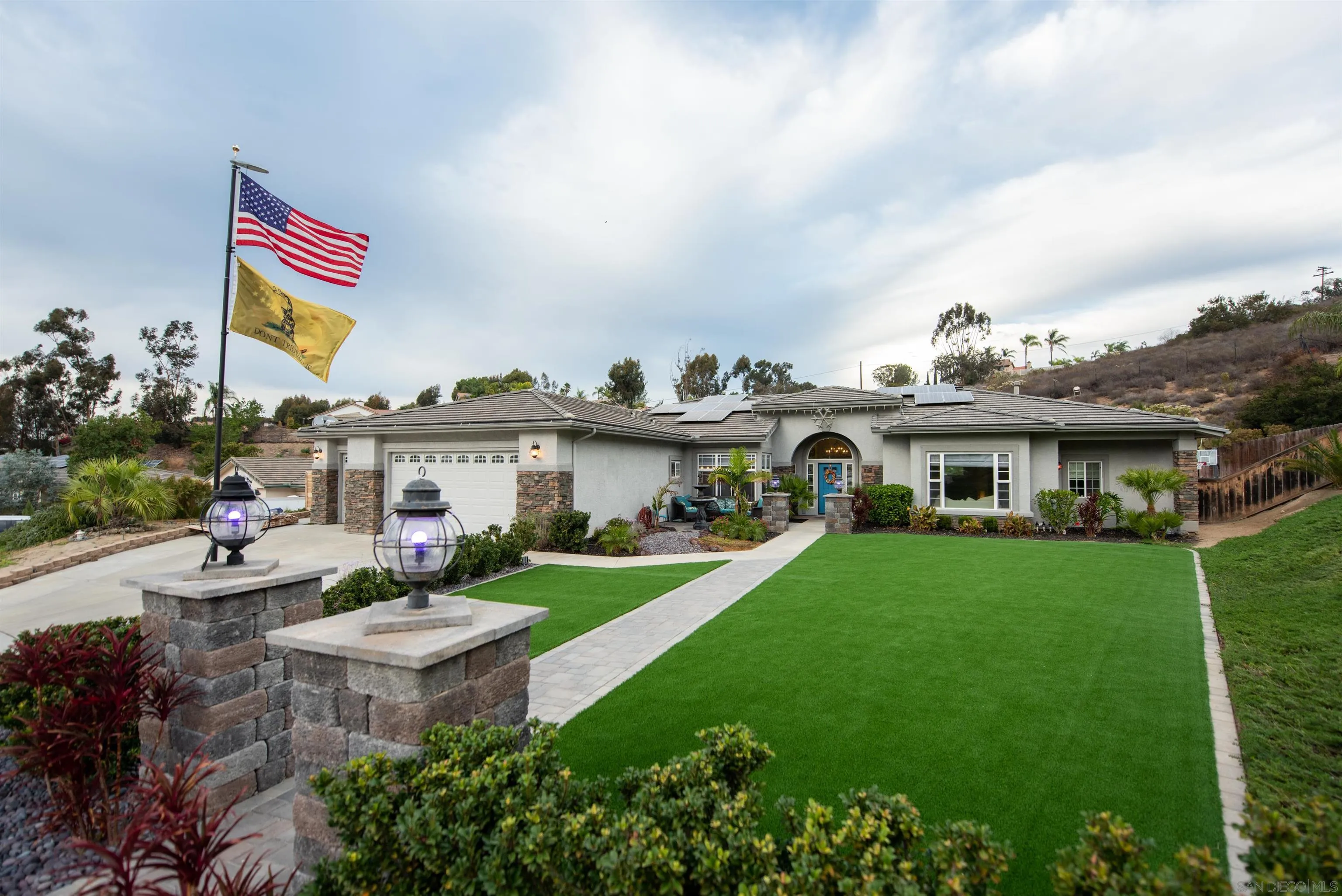 8945 Diamondback Drive Santee, CA 92071 - Photo 3 of 49 a front view of a house with garden