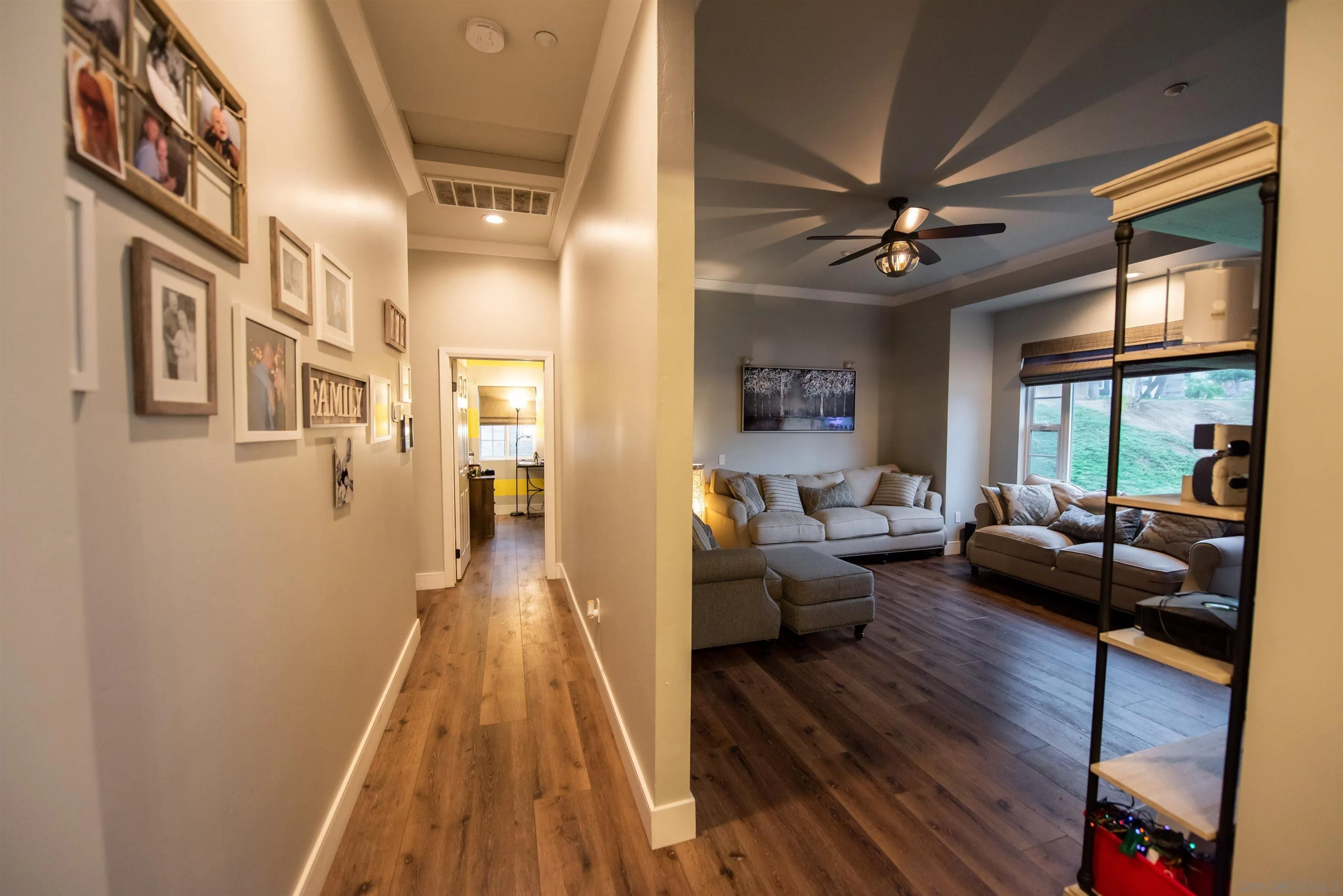 8945 Diamondback Drive Santee, CA 92071 - Photo 31 of 49 a living room with furniture and a wooden floor