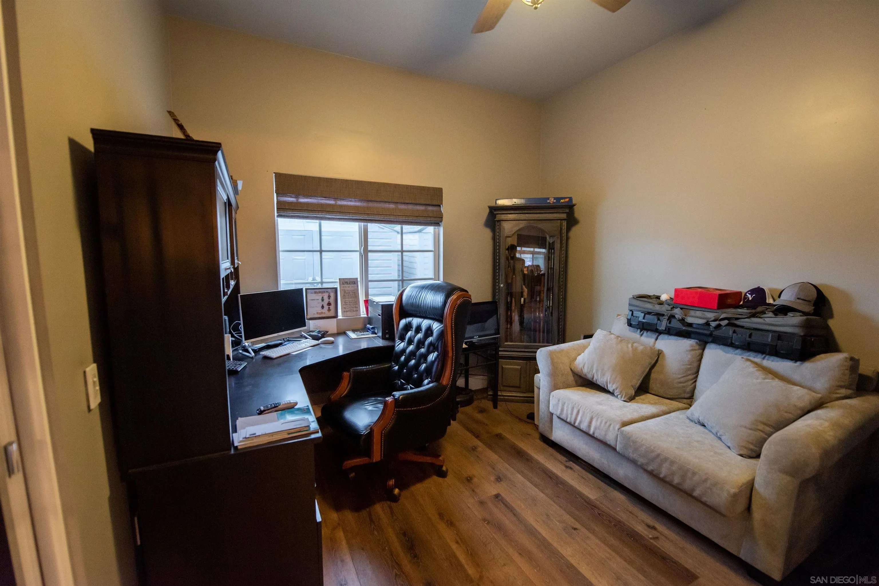 8945 Diamondback Drive Santee, CA 92071 - Photo 36 of 49 a living room with furniture and a flat screen tv