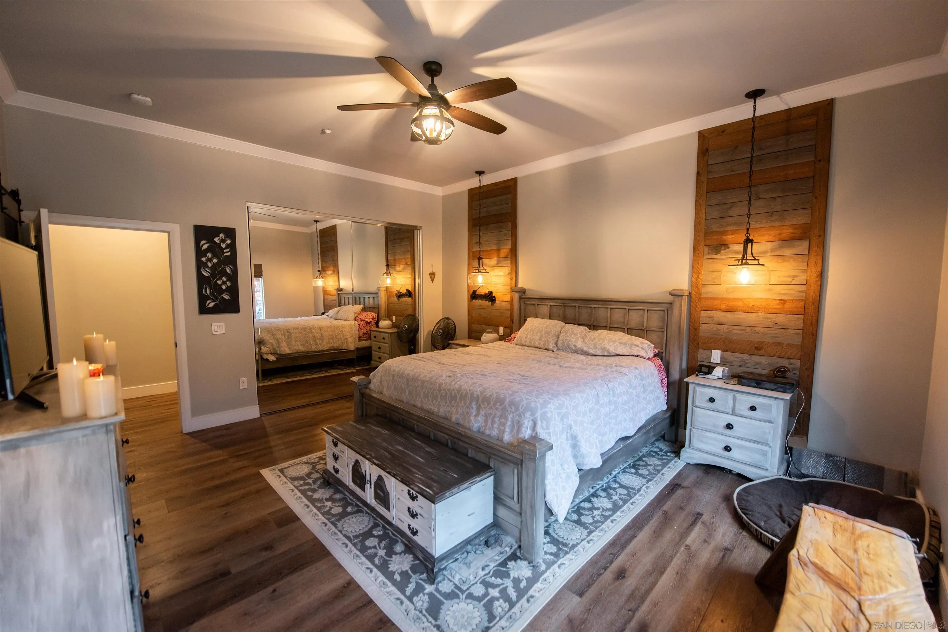 8945 Diamondback Drive Santee, CA 92071 - Photo 40 of 49 a spacious bedroom with a bed and a chandelier