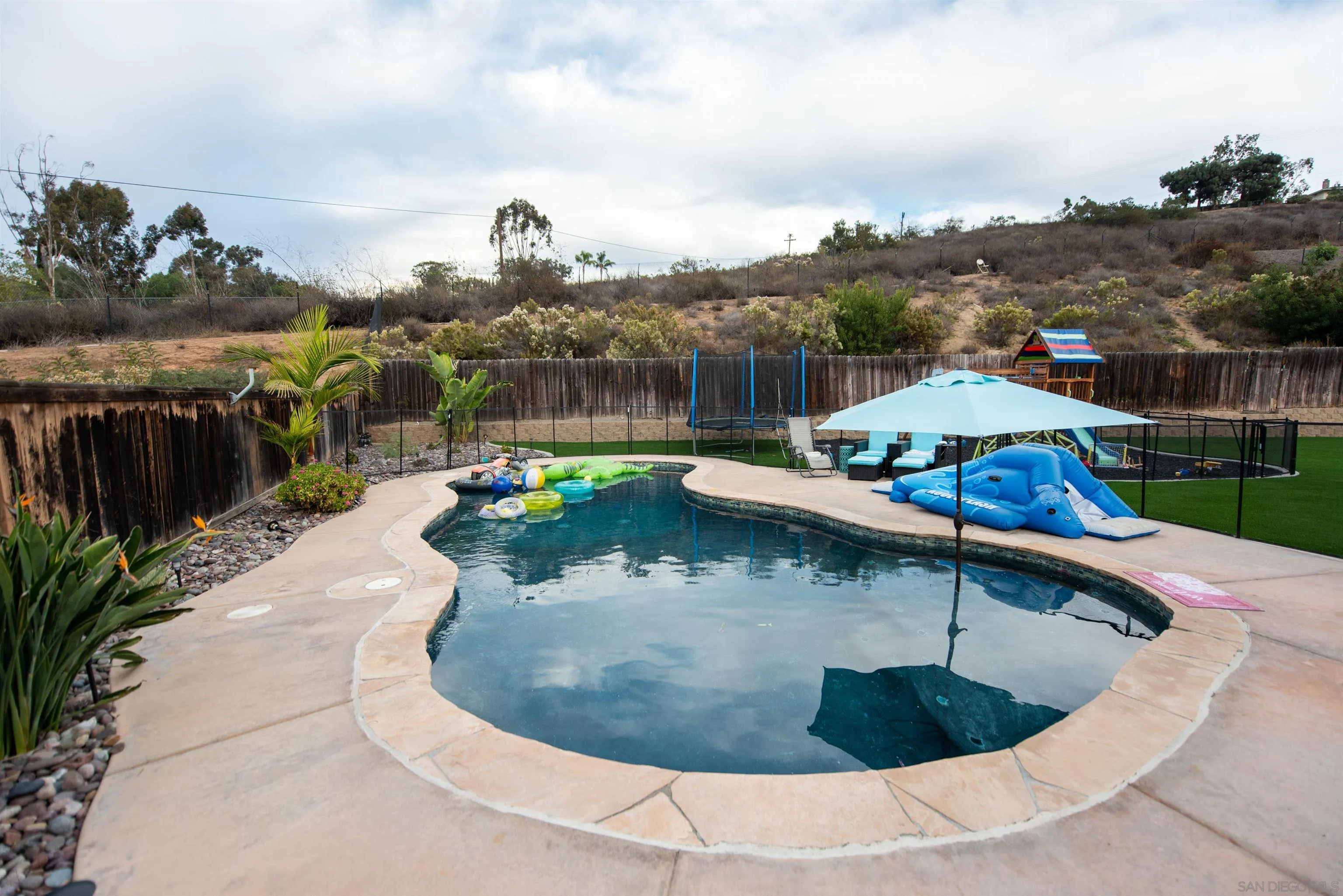 8945 Diamondback Drive Santee, CA 92071 - Photo 45 of 49 a view of a swimming pool with a lounge chairs