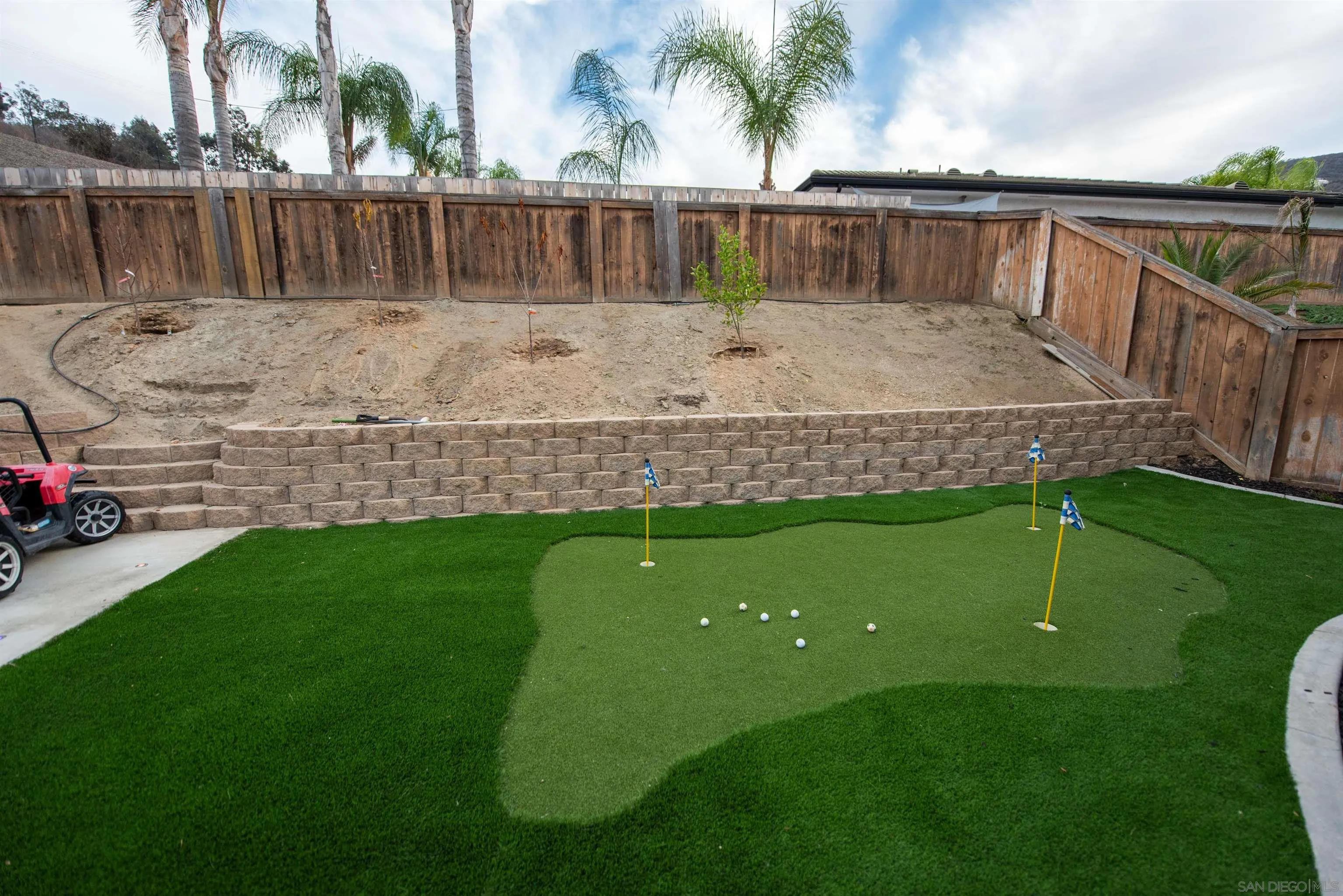 8945 Diamondback Drive Santee, CA 92071 - Photo 47 of 49 a view of a backyard with wooden fence