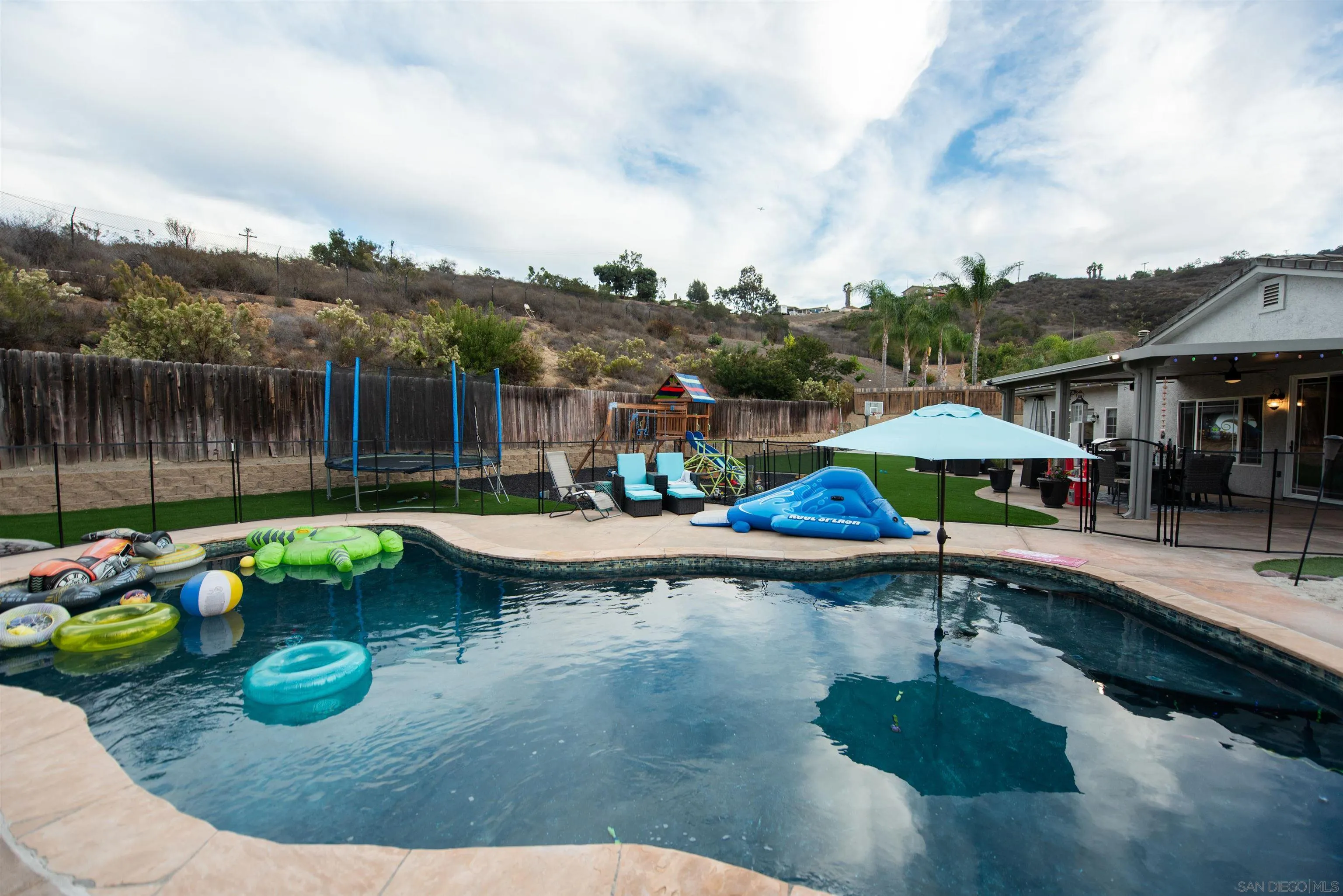 8945 Diamondback Drive Santee, CA 92071 - Photo 48 of 49 a small pool with outdoor seating water slide and barbeque oven