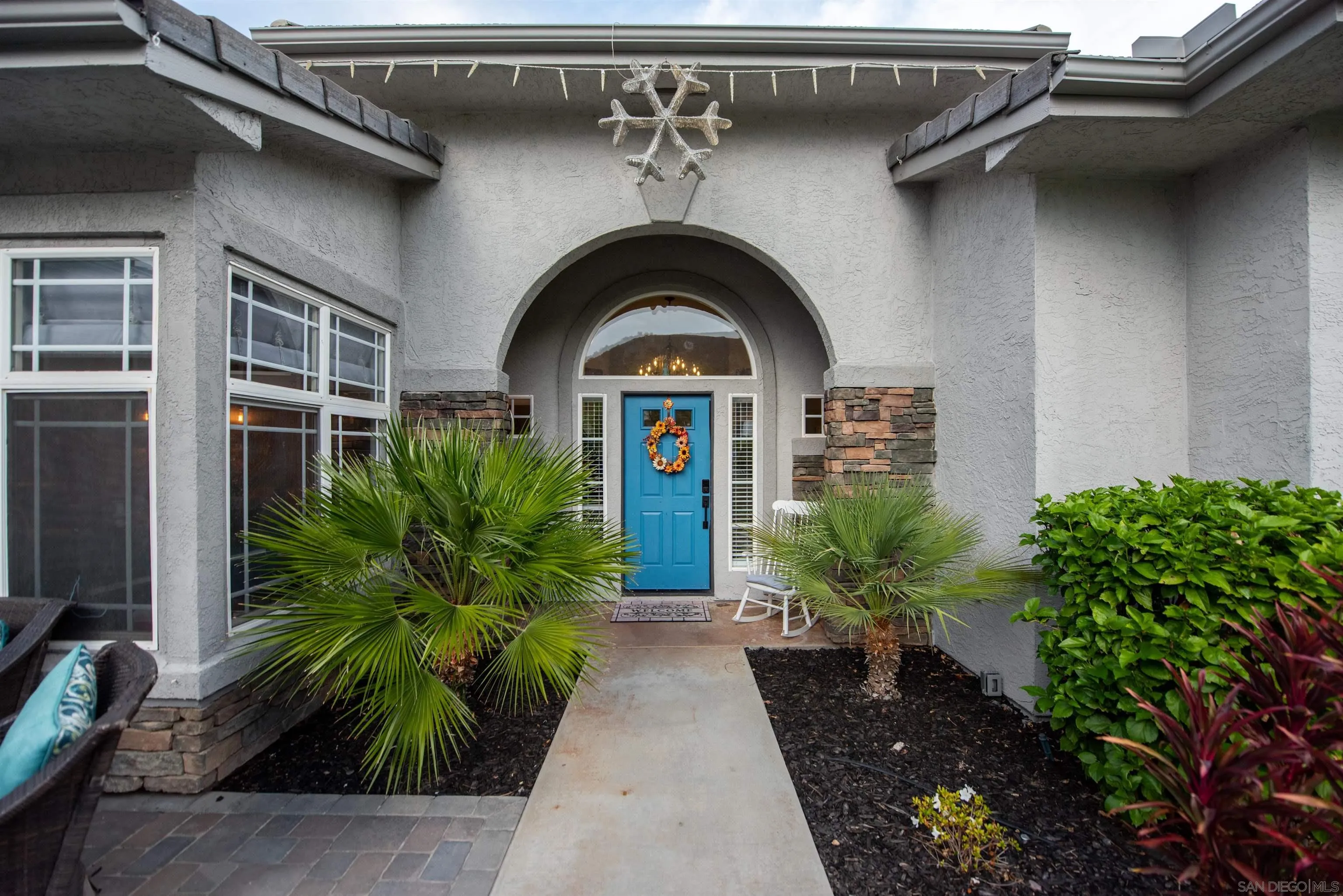 8945 Diamondback Drive Santee, CA 92071 - Photo 7 of 49 a front view of a house with garden
