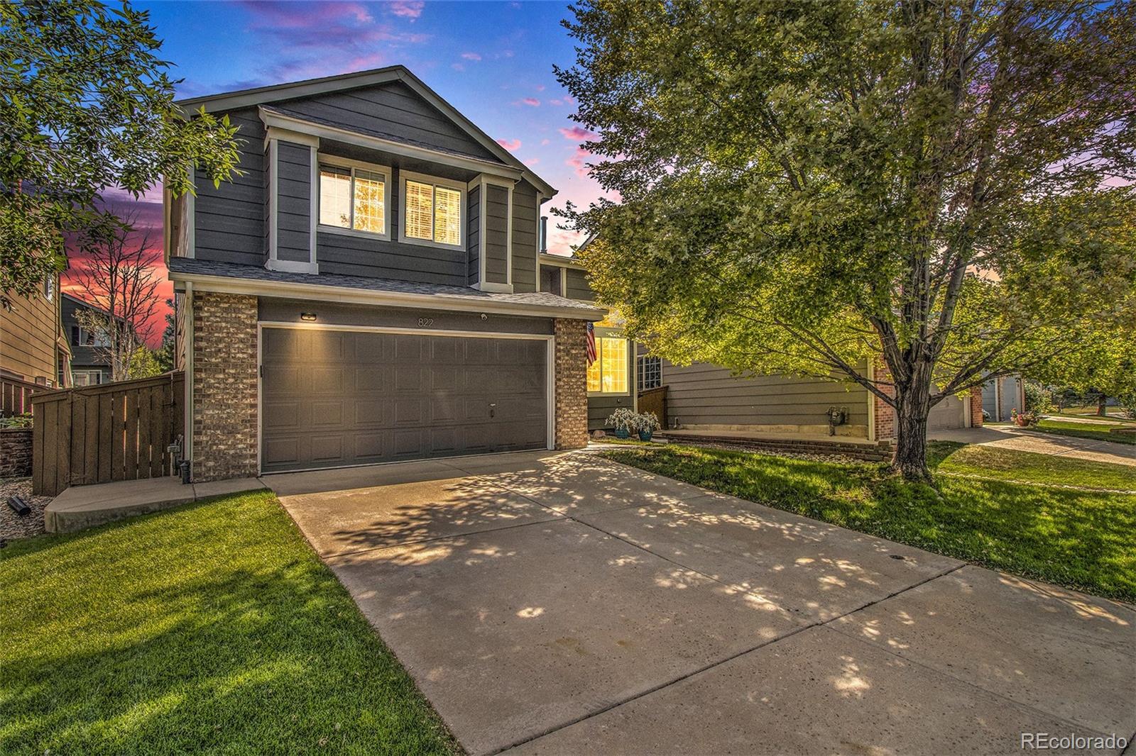 822 Timbervale Trail Highlands Ranch, CO 80129 - Photo 1 of 34 a view of a house with a yard