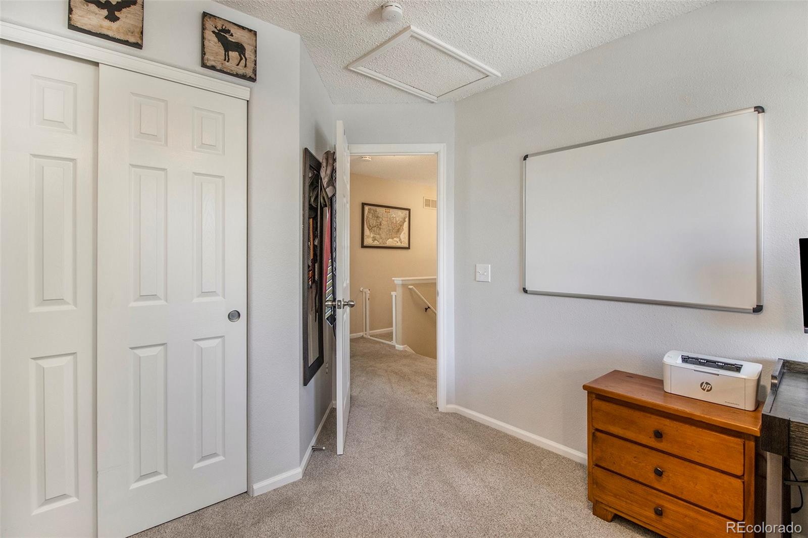 822 Timbervale Trail Highlands Ranch, CO 80129 - Photo 23 of 34 a room that has a dresser in it