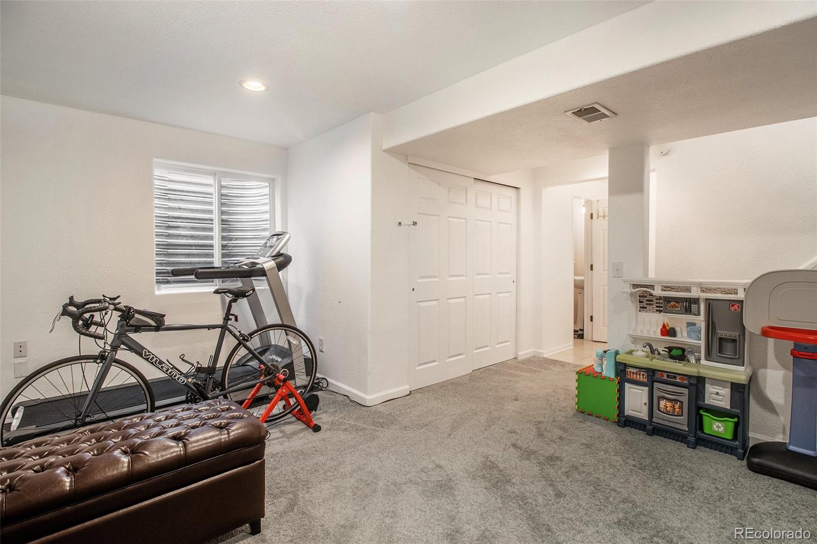 822 Timbervale Trail Highlands Ranch, CO 80129 - Photo 26 of 34 a view of a room with gym equipment