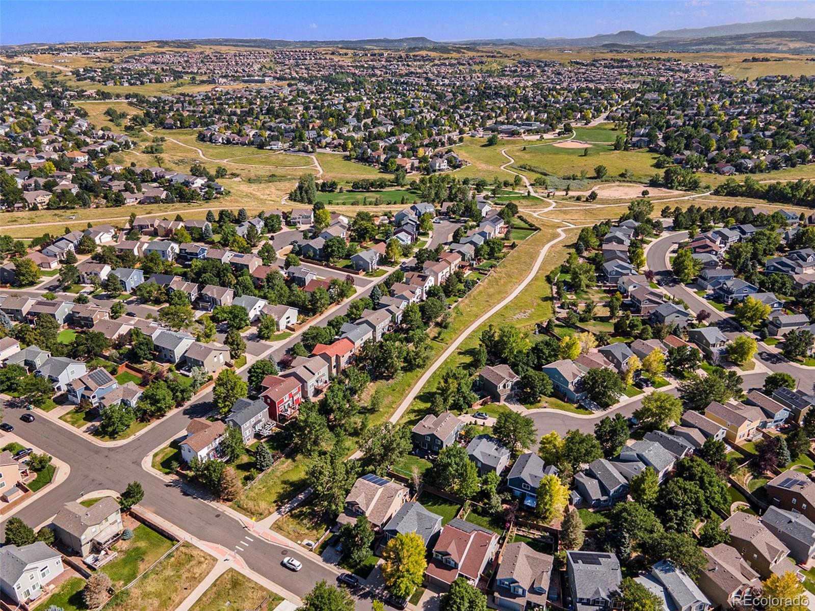 822 Timbervale Trail Highlands Ranch, CO 80129 - Photo 33 of 34 an aerial view of residential houses with outdoor space