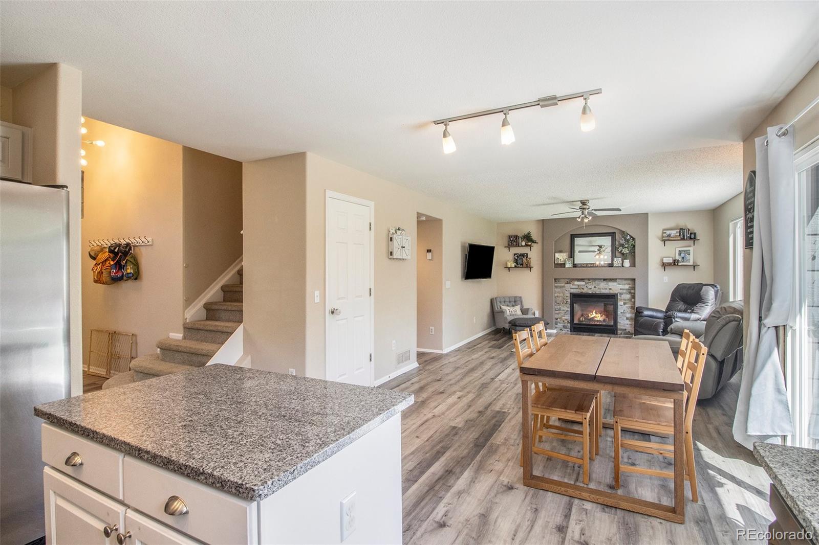 822 Timbervale Trail Highlands Ranch, CO 80129 - Photo 5 of 34 a living room with furniture and wooden floor