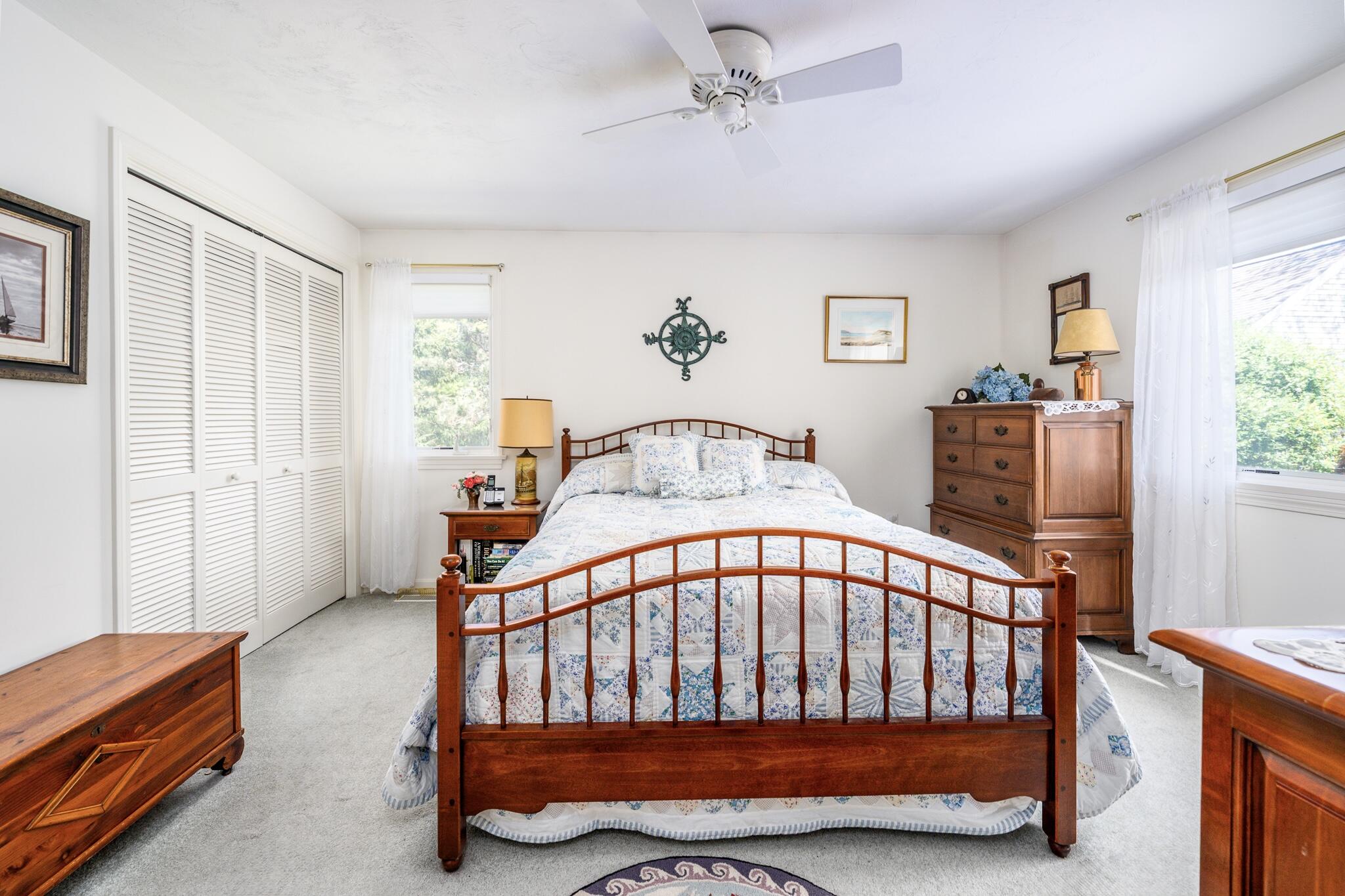 7 Masters Court Mashpee, MA 02649 - Photo 19 of 34 a bedroom with furniture and a window